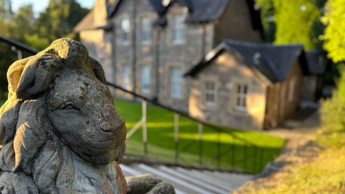 Lion with Manor House in Background Sept 2024