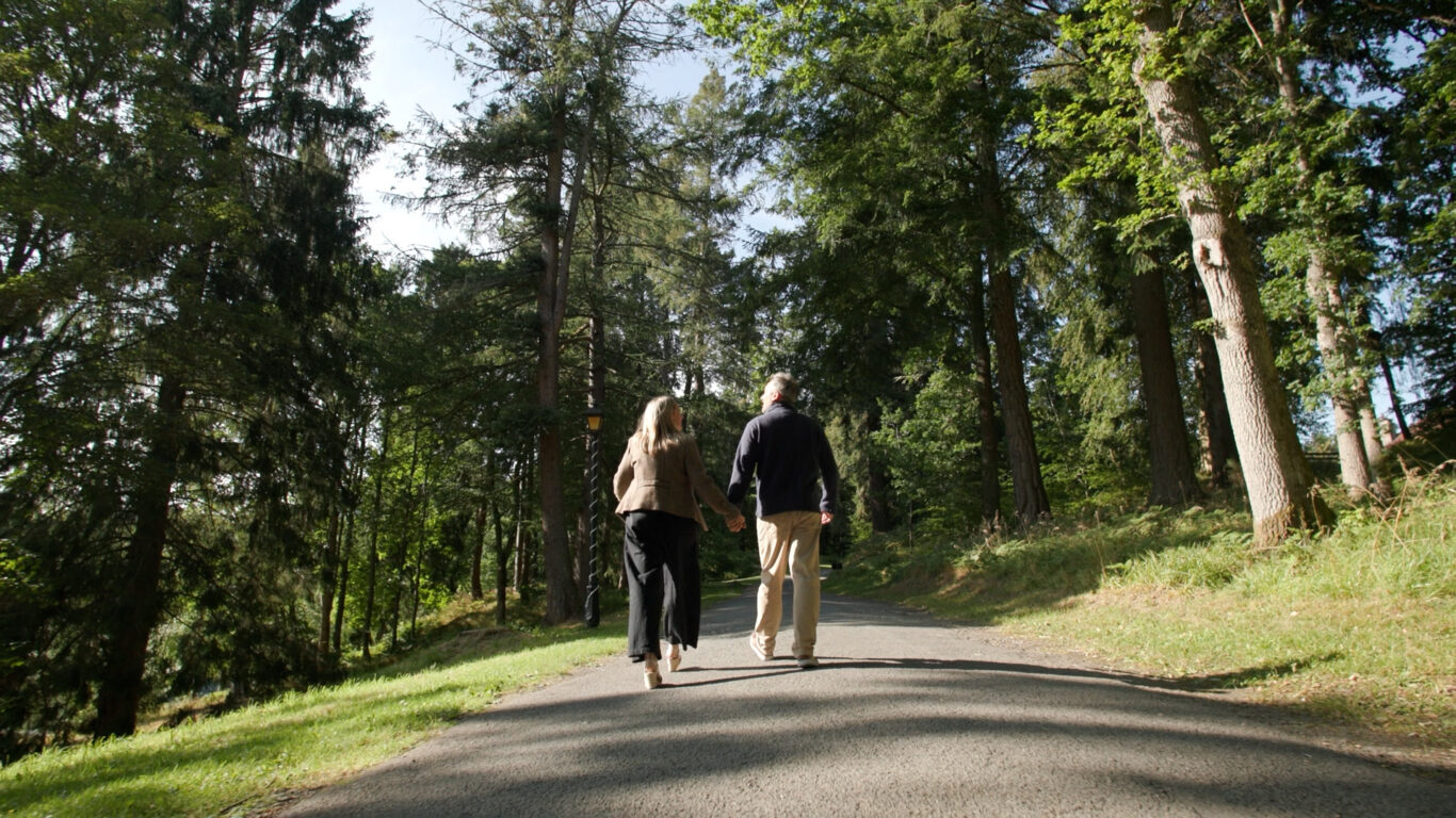 couple walking in atholl palace grounds, pitlochry